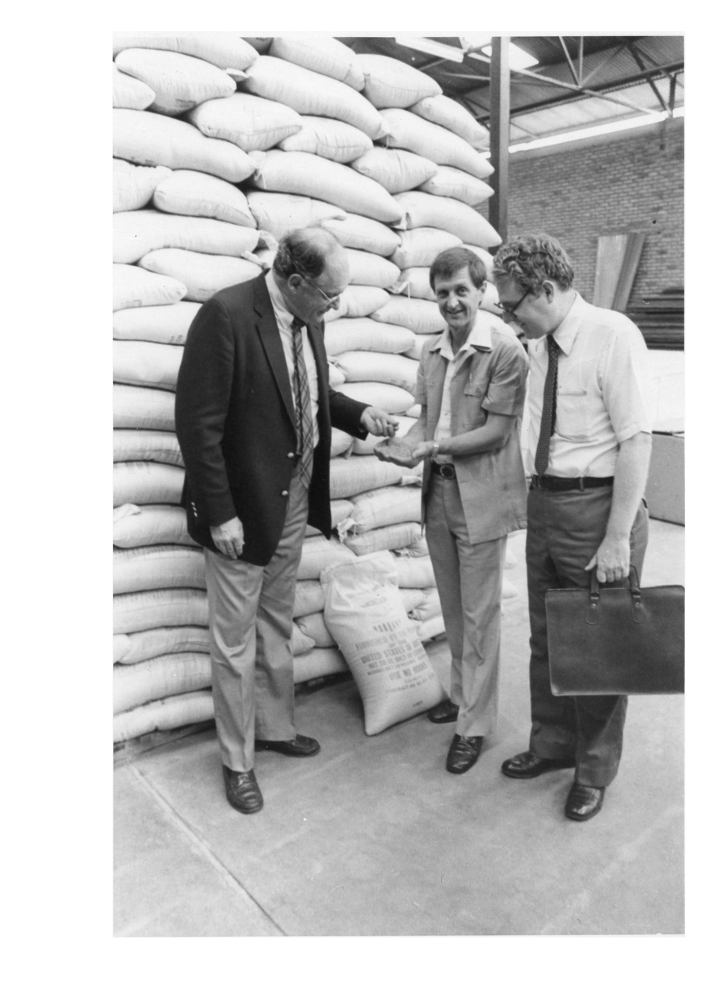 Ambassador John Blane and DCM Donald Hester Examine USAID  Food in ADRA Warehouse, Kigali, Rwanda