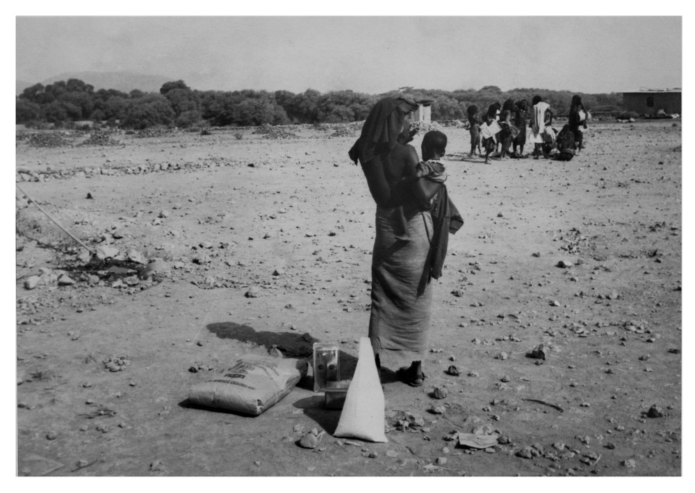 Woman and Child with AID Food