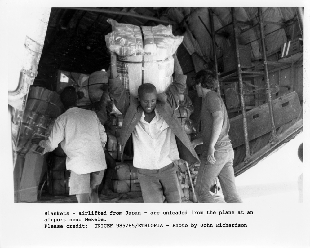 Unloading Blankets from Airplane