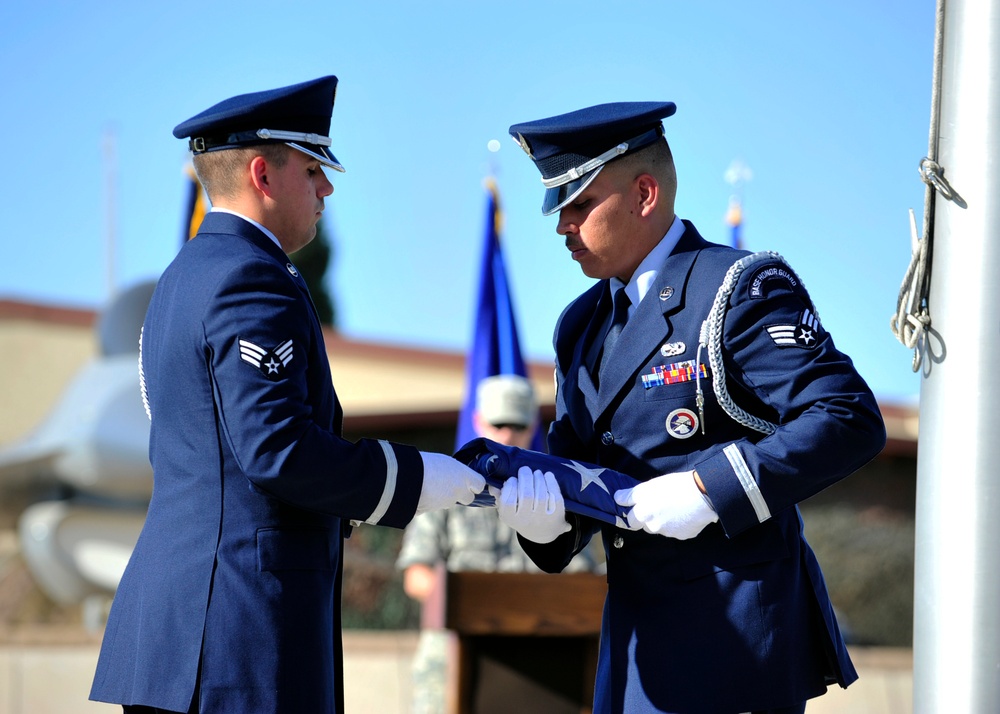 Luke Honor Guard members fold flag