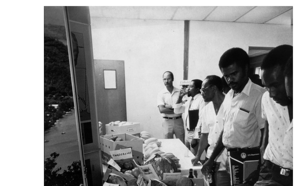 Men with Produce Display