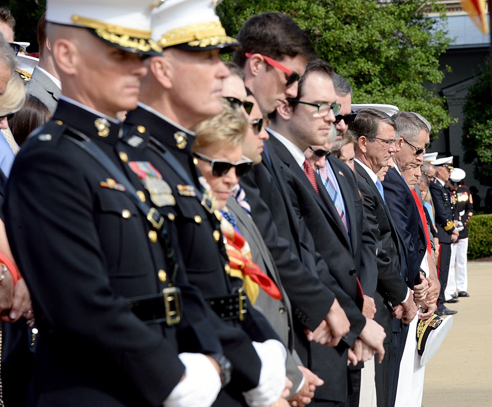 Secretary of defense bows his head during the invocation