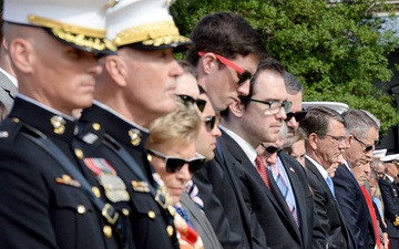 Secretary of defense bows his head during the invocation