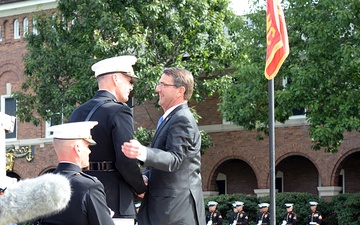 Secretary of defense shakes Marine Gen. Joseph F. Dunford Jr.'s hand