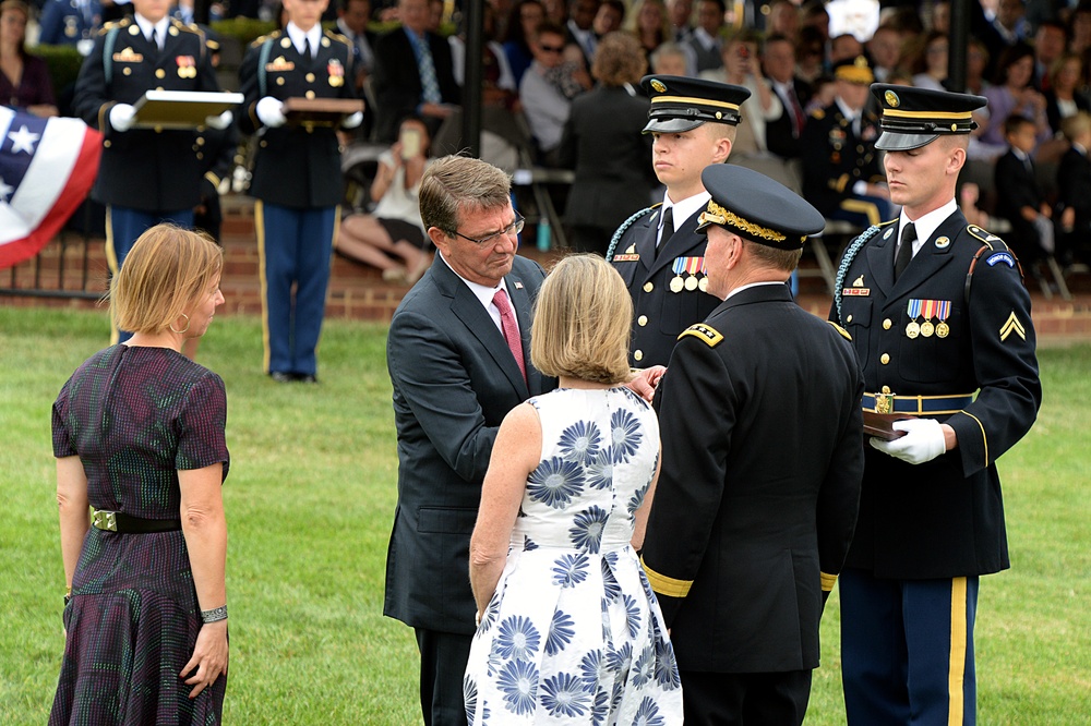 Secretary of defense pins on outgoing CJCS Army Gen. Martin E. Dempsey's award