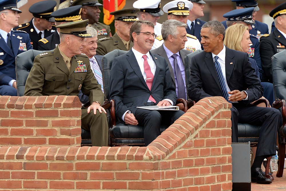 Secretary of defense shares a smile with POTUS