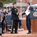 Secretary of defense shakes hands with outgoing chairman of the Joint Chiefs of Staff