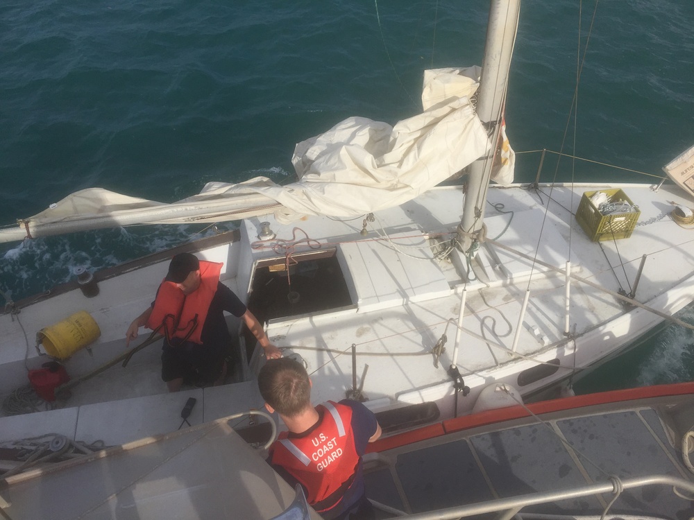 Coast Guard Station Honolulu tows aground sailboat in Kalihi Channel