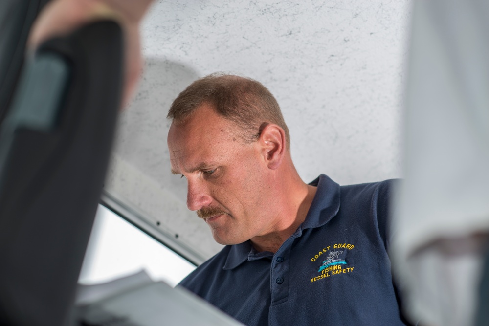 Lt. Cmdr. David Cripe inspects a new fishing vessel