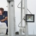 A Coast Guard marine inspector checks the integrity of a life raft