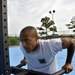 Petty Officer 1st Class Raymond Concepcion demonstrates workout