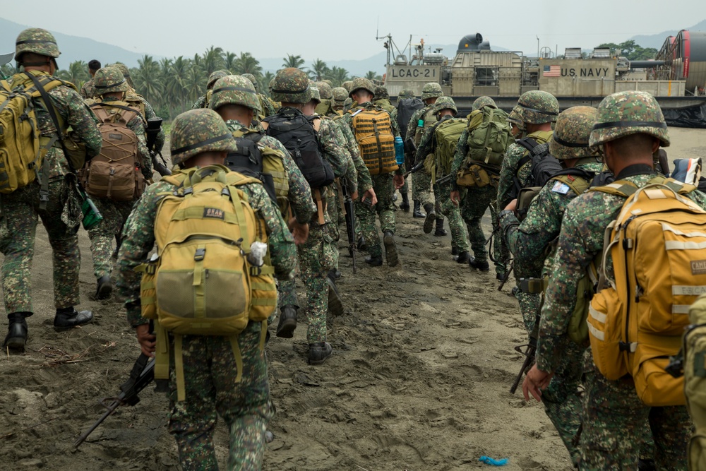 Filipinos get a ride in Marine amphibious landing craft