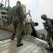 Filipinos get a ride in Marine amphibious landing craft