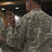 Outgoing battalion commander hands off guidon to brigade commander