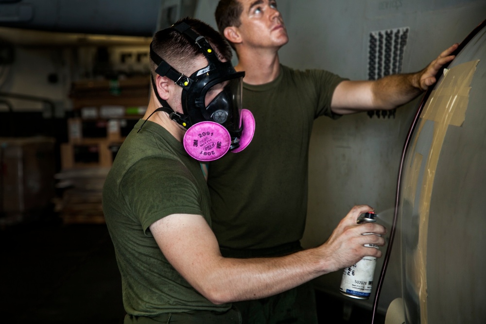 US Marines perform maintenance at sea