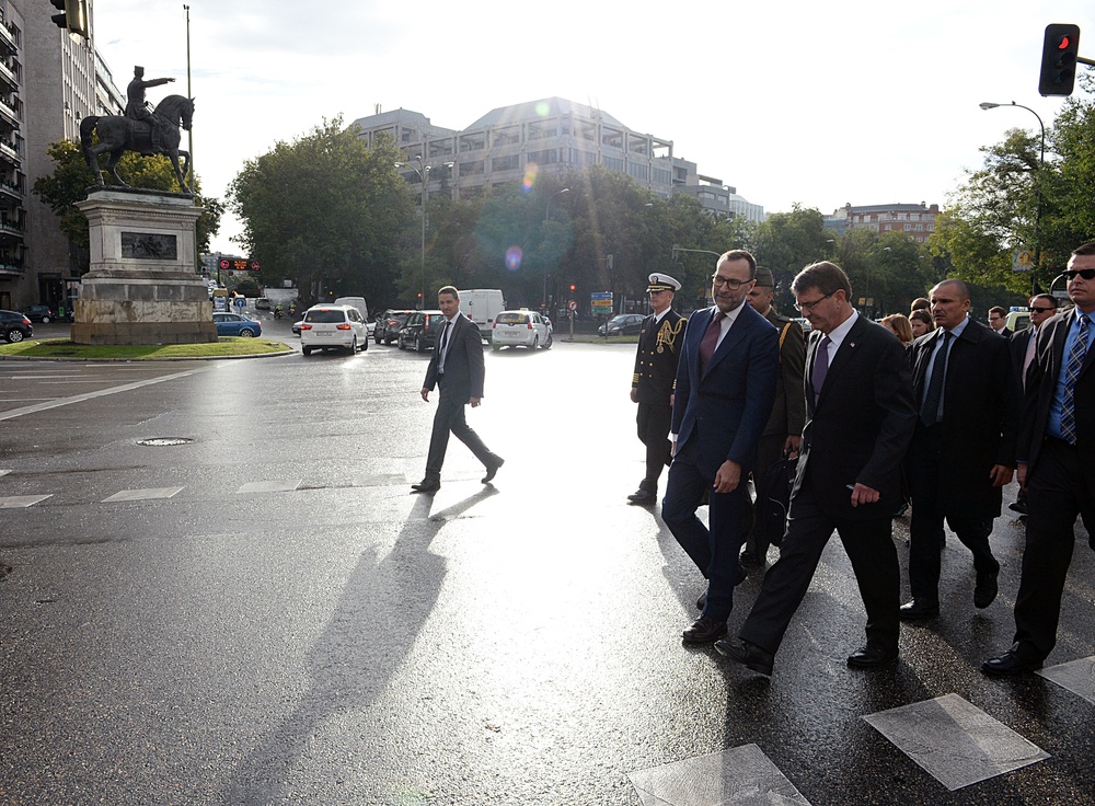 Secretary of defense walks to the CESEDEN