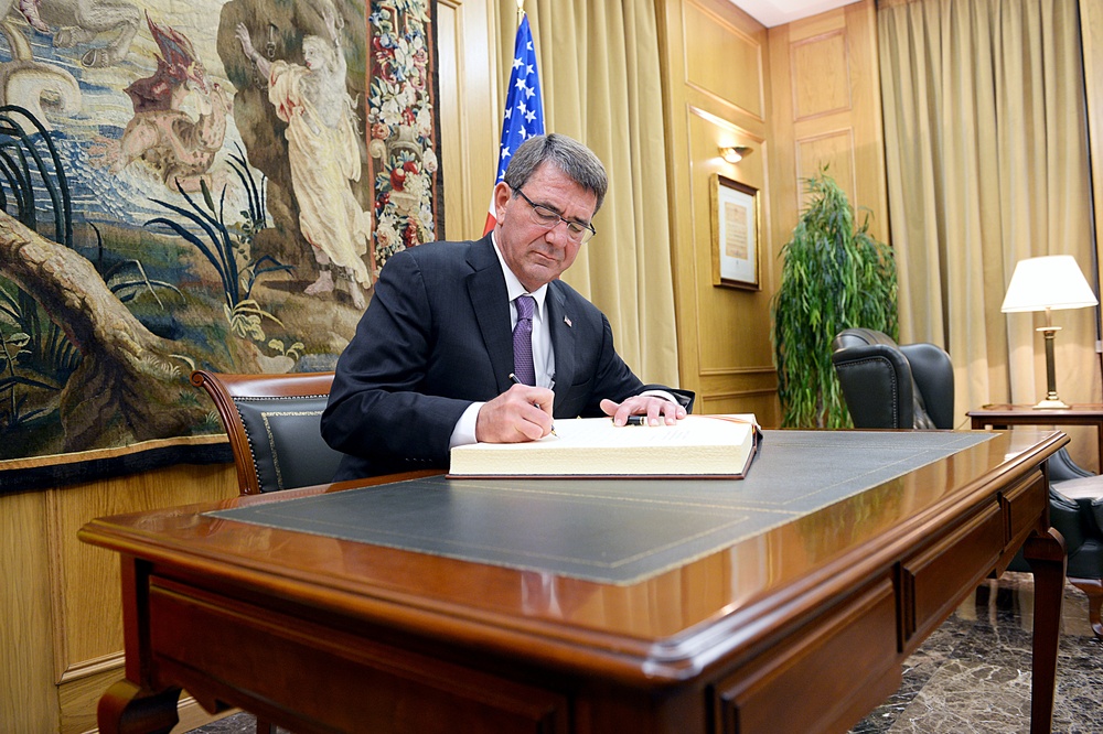 Secretary of defense signs guest book after his remarks at CESEDEN