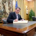 Secretary of defense signs guest book after his remarks at CESEDEN