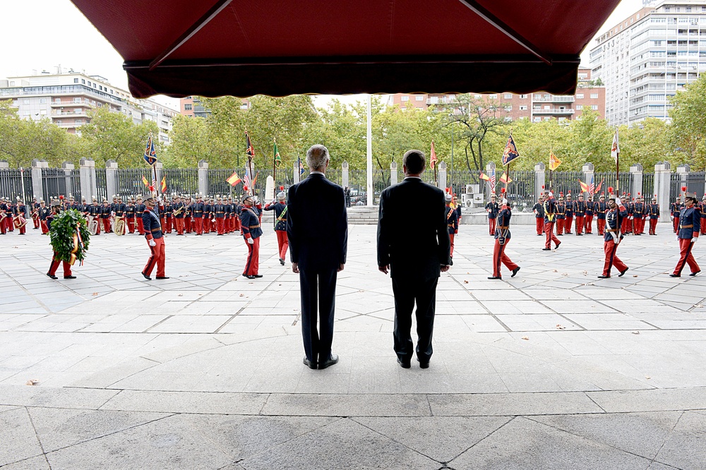 Secretary of defense, Spain's MOD stand at attention during honors, wreath-laying ceremony