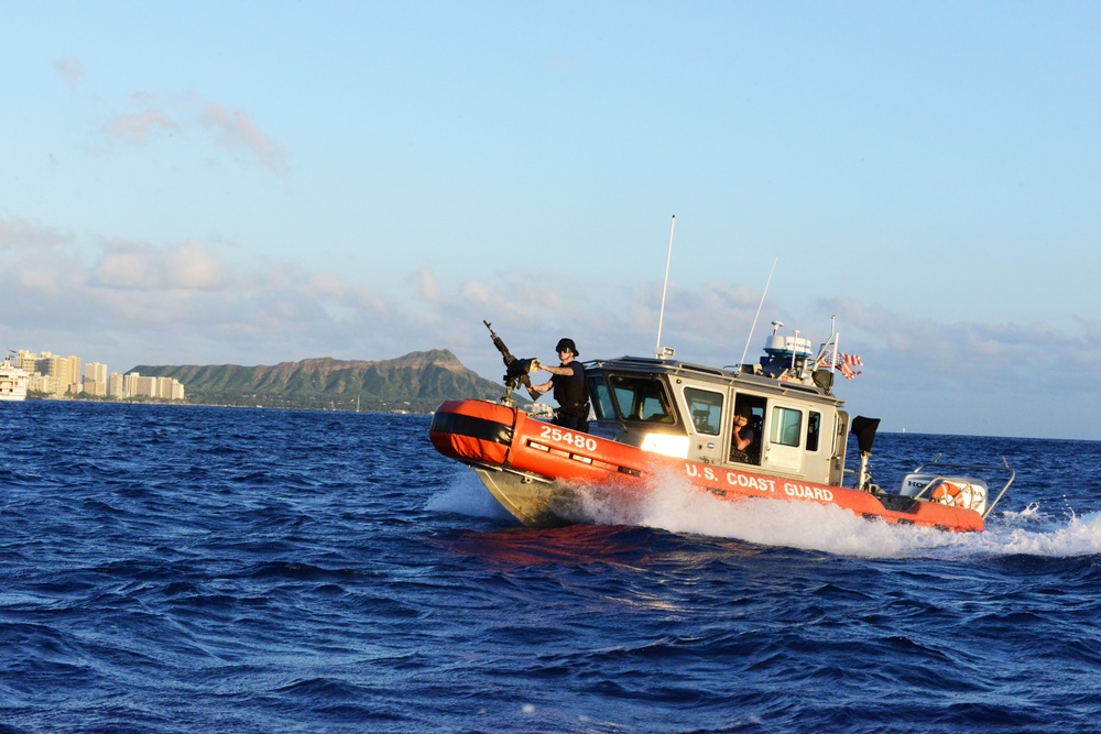 Maritime Safety and Security Team 91107 escorts cruise ship in Honolulu Harbor