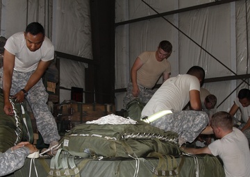 Lifeliners prepare aerial delivery bundles at JRTC