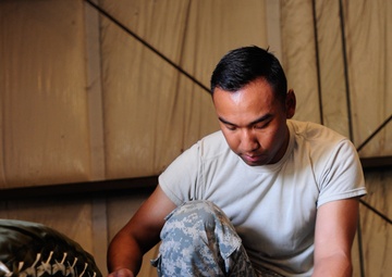 Lifeliners prepare aerial delivery bundles at JRTC