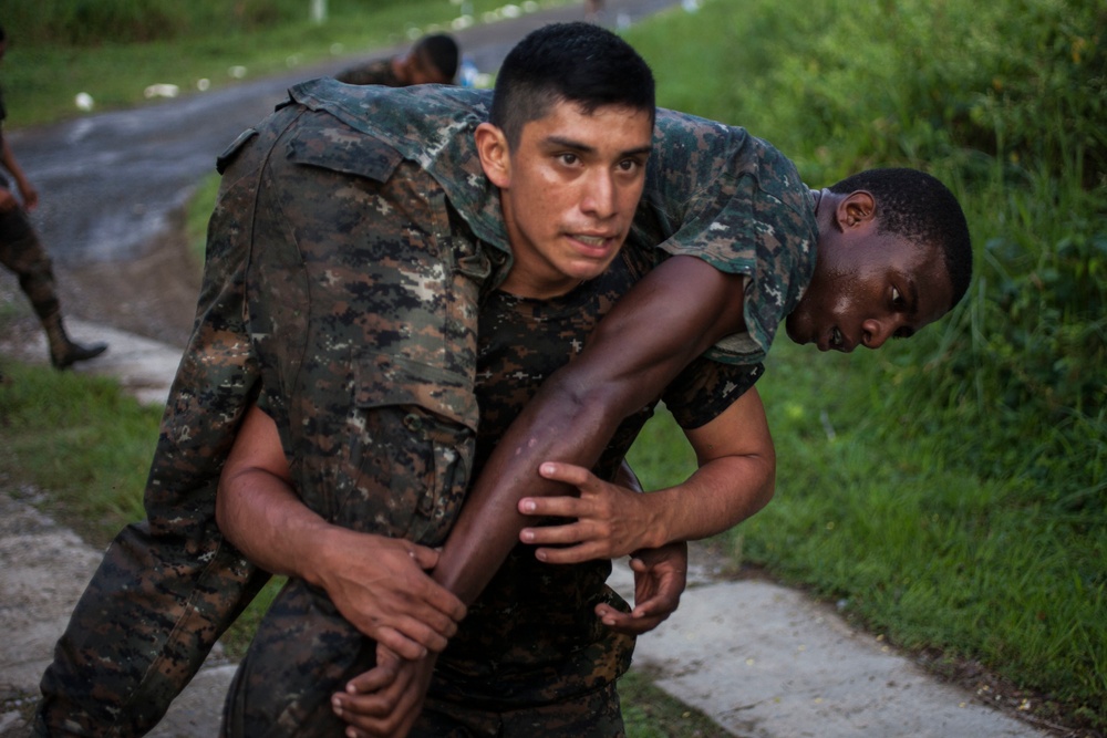 U.S. Marines with SCT-Guatemala, SPMAGTF-SC, lead the Brigada de Infanteria Marina in physical training