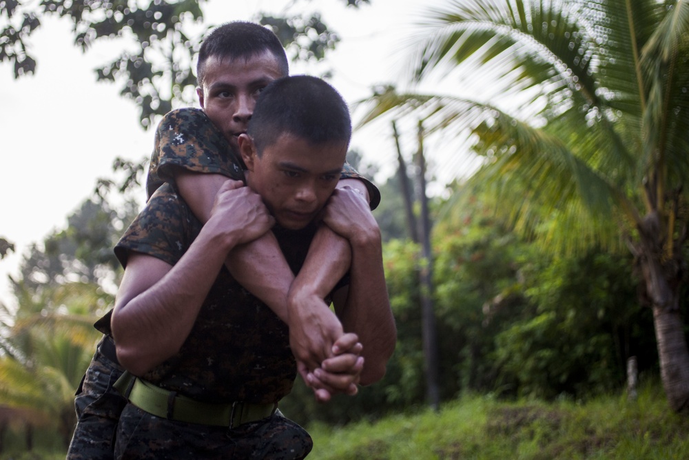 U.S. Marines with SCT-Guatemala, SPMAGTF-SC, lead the Brigada de Infanteria Marina in physical training