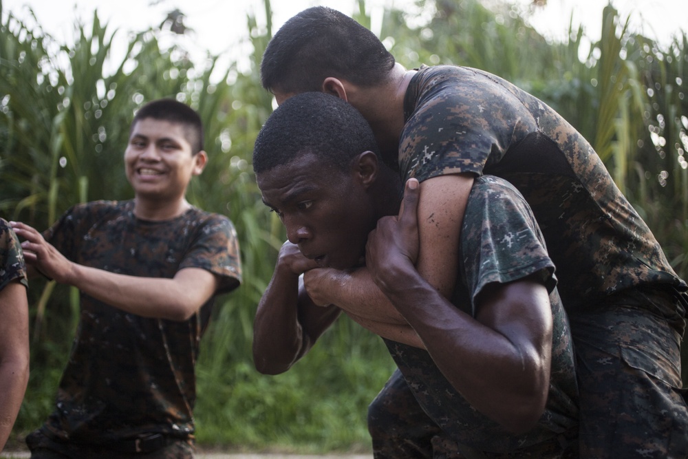 U.S. Marines with SCT-Guatemala, SPMAGTF-SC, lead the Brigada de Infanteria Marina in physical training