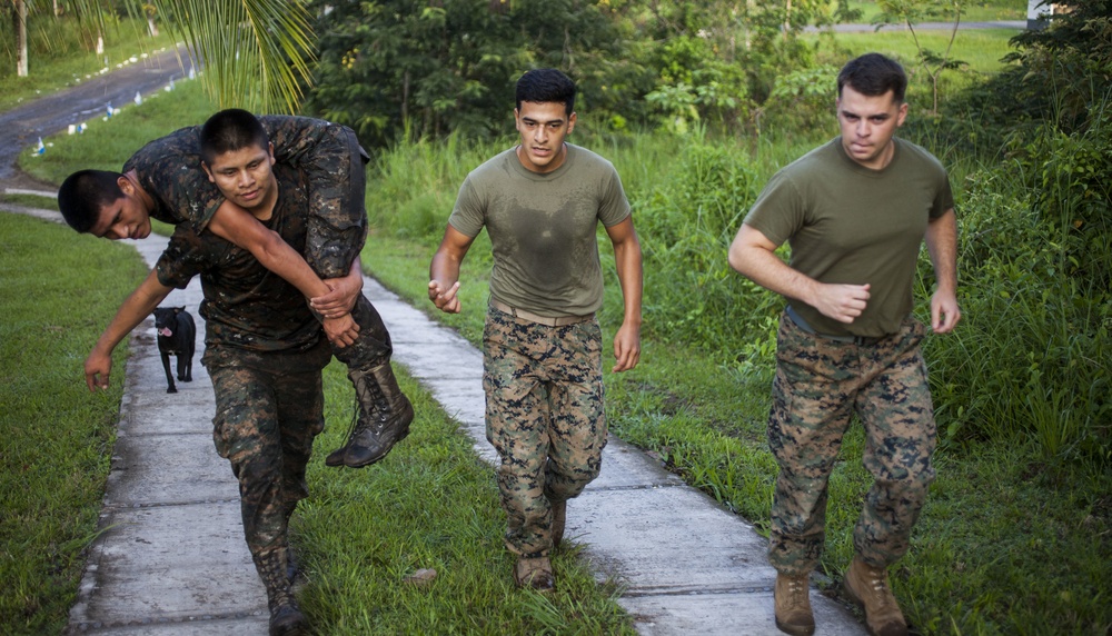 U.S. Marines with SCT-Guatemala, SPMAGTF-SC, lead the Brigada de Infanteria Marina in physical training