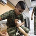 U.S. Marines with SCT-Guatemala, SPMAGTF-SC, teach the Brigada de Infanteria Marina handcuffing techniques