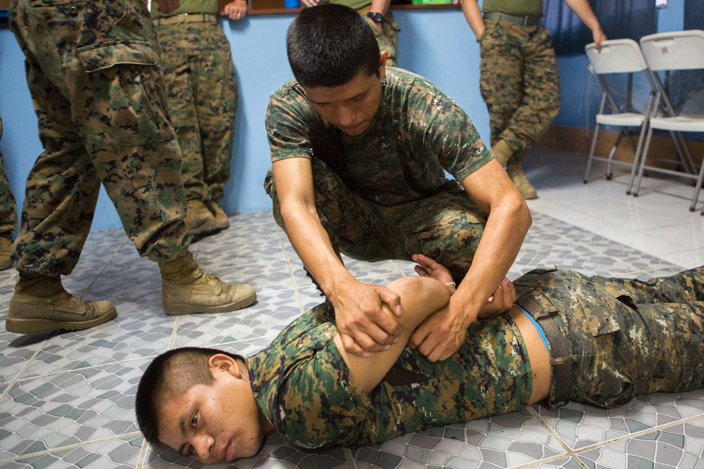 U.S. Marines with SCT-Guatemala, SPMAGTF-SC, lead the Brigada de Infanteria Marina in physical training