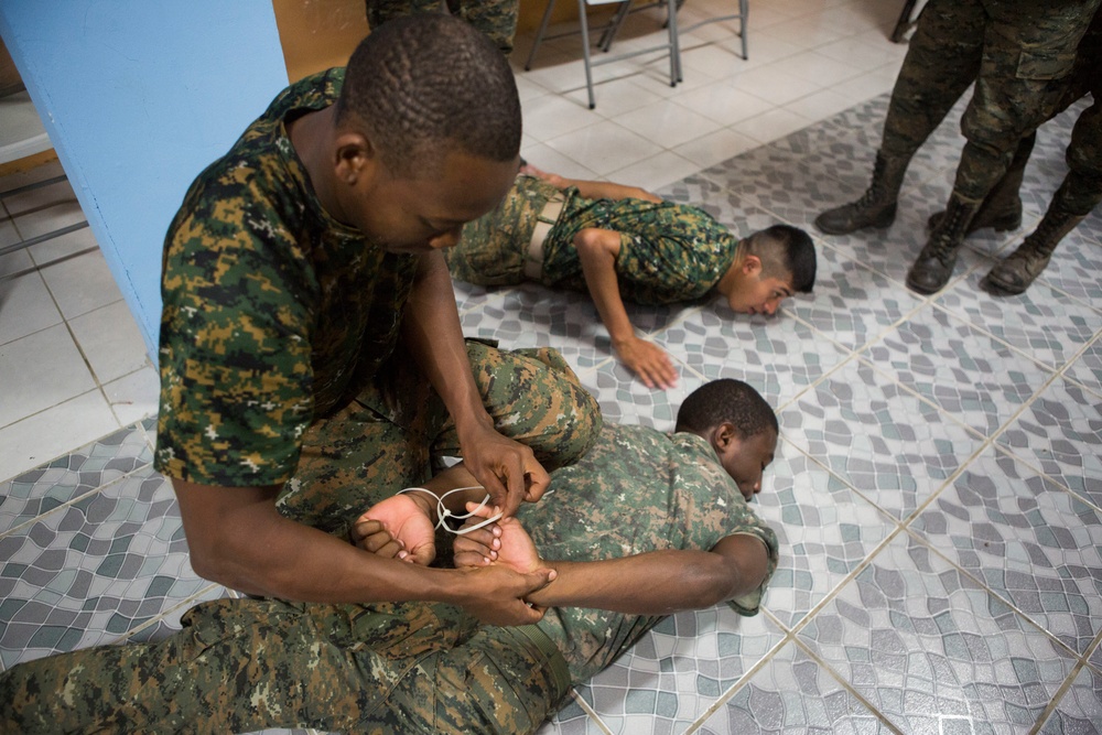 U.S. Marines with SCT-Guatemala, SPMAGTF-SC, lead the Brigada de Infanteria Marina in physical training