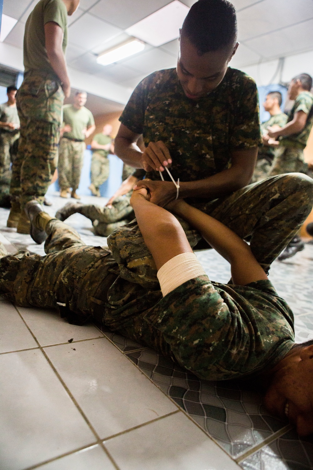 U.S. Marines with SCT-Guatemala, SPMAGTF-SC, lead the Brigada de Infanteria Marina in physical training