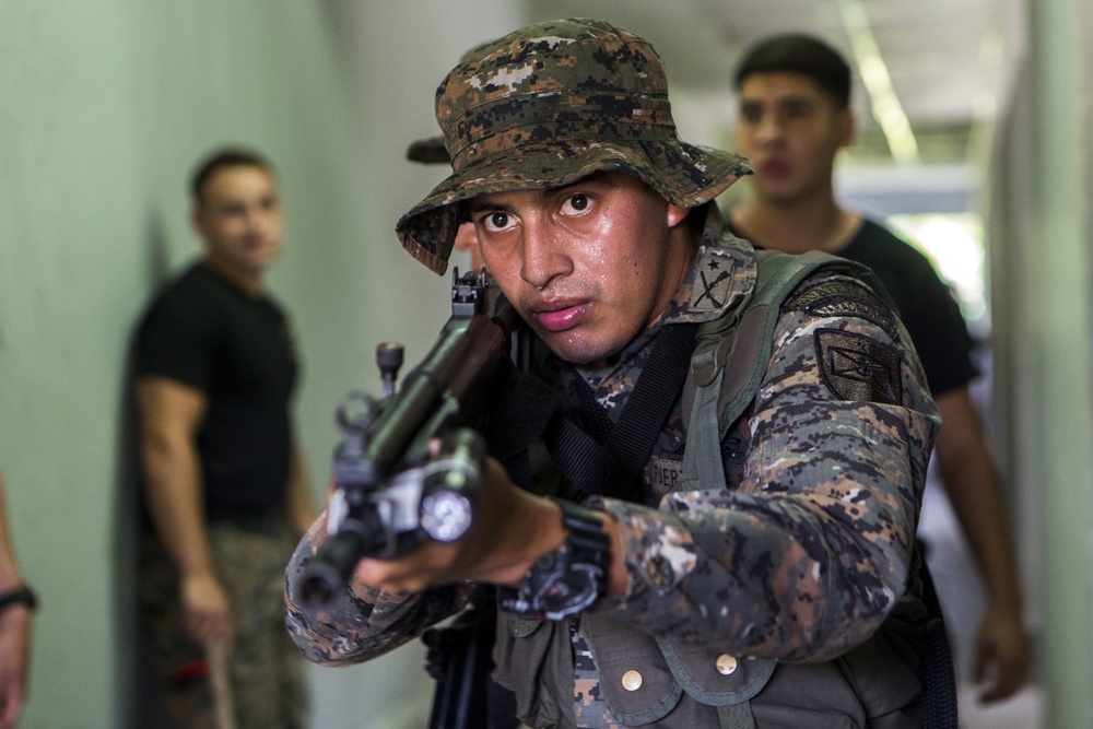 U.S. Marines with SCT-Guatemala, SPMAGTF-SC, teach room clearing tactics to the Brigada de Infanteria Marina