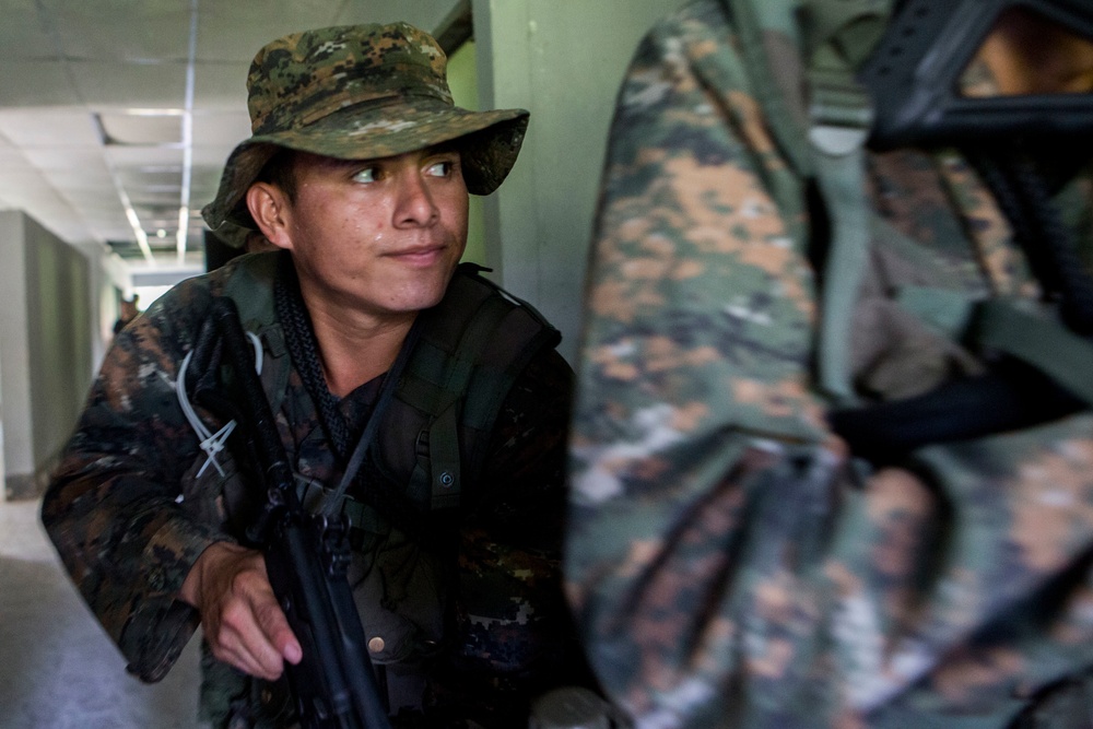 U.S. Marines with SCT-Guatemala, SPMAGTF-SC, teach room clearing tactics to the Brigada de Infanteria Marina