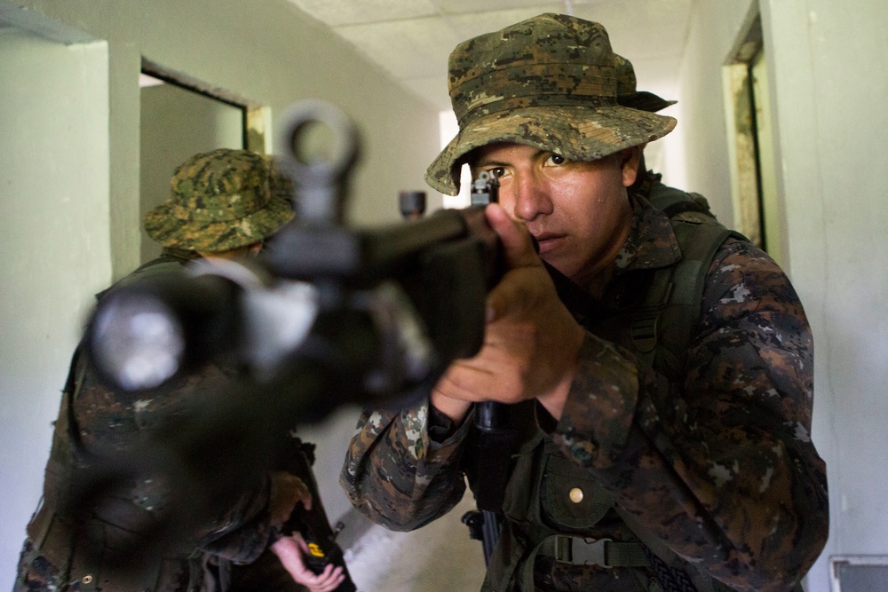 U.S. Marines with SCT-Guatemala, SPMAGTF-SC, teach room clearing tactics to the Brigada de Infanteria Marina