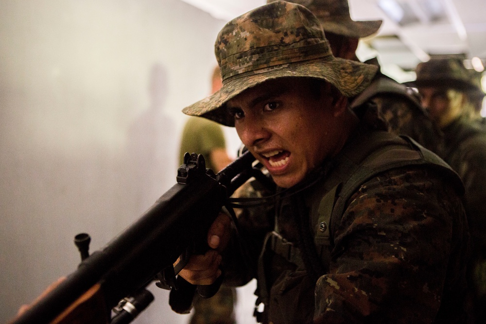 U.S. Marines with SCT-Guatemala, SPMAGTF-SC, teach room clearing tactics to the Brigada de Infanteria Marina