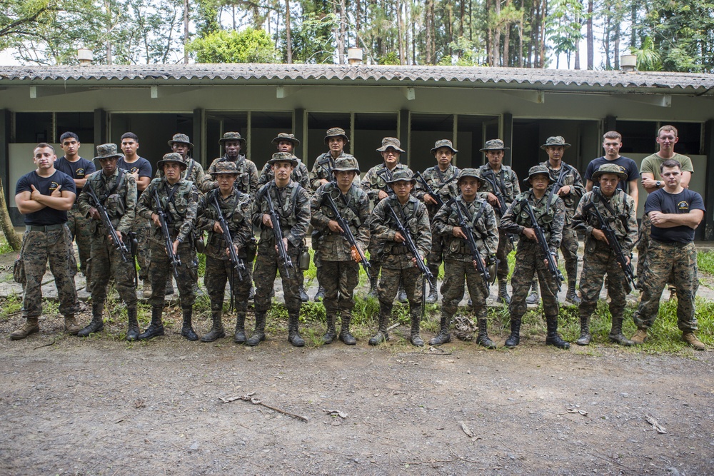 U.S. Marines with SCT-Guatemala, SPMAGTF-SC, take a group photo with Brigada de Infanteria Marina