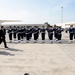 Secretary of defense and Italian Defense Minister Roberta Pinotti pass in front of troops during the honors arrival ceremony