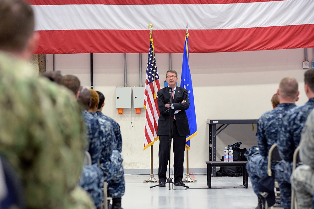 Secretary of defense speaks with troops during a troop event