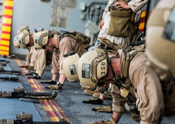 U.S. Marines fatigue bodies, fire weapons