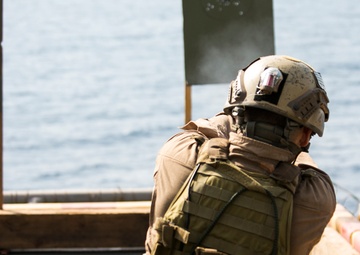 U.S. Marines fatigue bodies, fire weapons