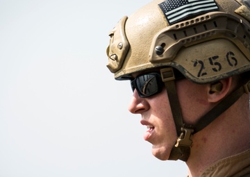 U.S. Marines fatigue bodies, fire weapons