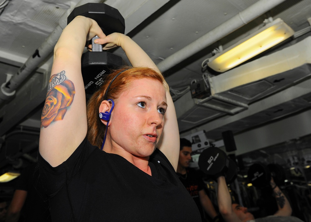 USS Theodore Roosevelt Sailor works out