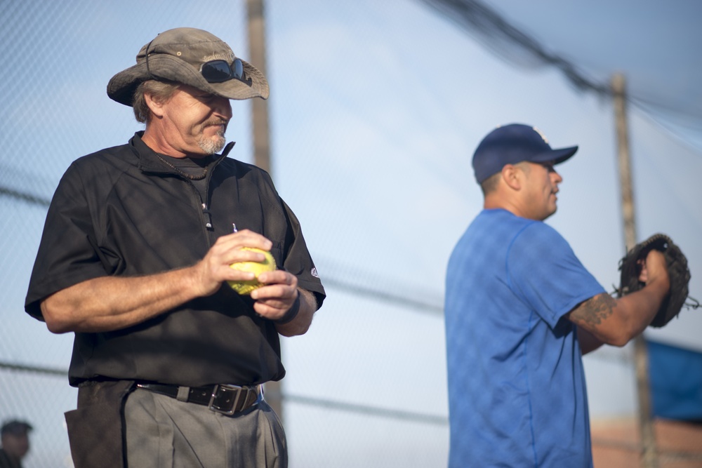 Retired Coast Guard chief warrant officer returns to Coast Guard Island to perform umpire duties for the Fleet Week interagency softball tournament