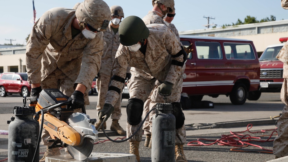 Marines, firefighters cut through training obstacles