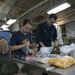 USS Essex Sailors inspect life raft survival equipment