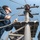 USS Essex Sailor raises the ensign