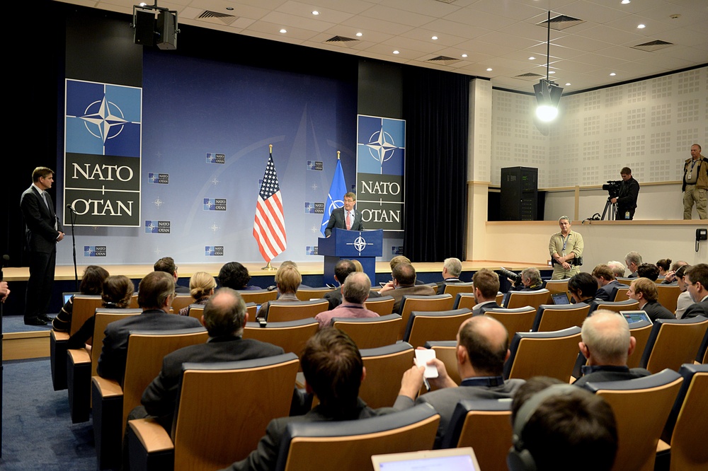 Secretary of defense answers questions during a press conference at NATO Headquarters